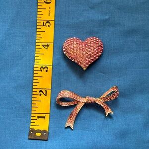 Two pink brooches